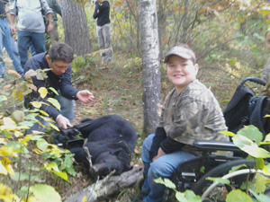 A young hunter and his black bear